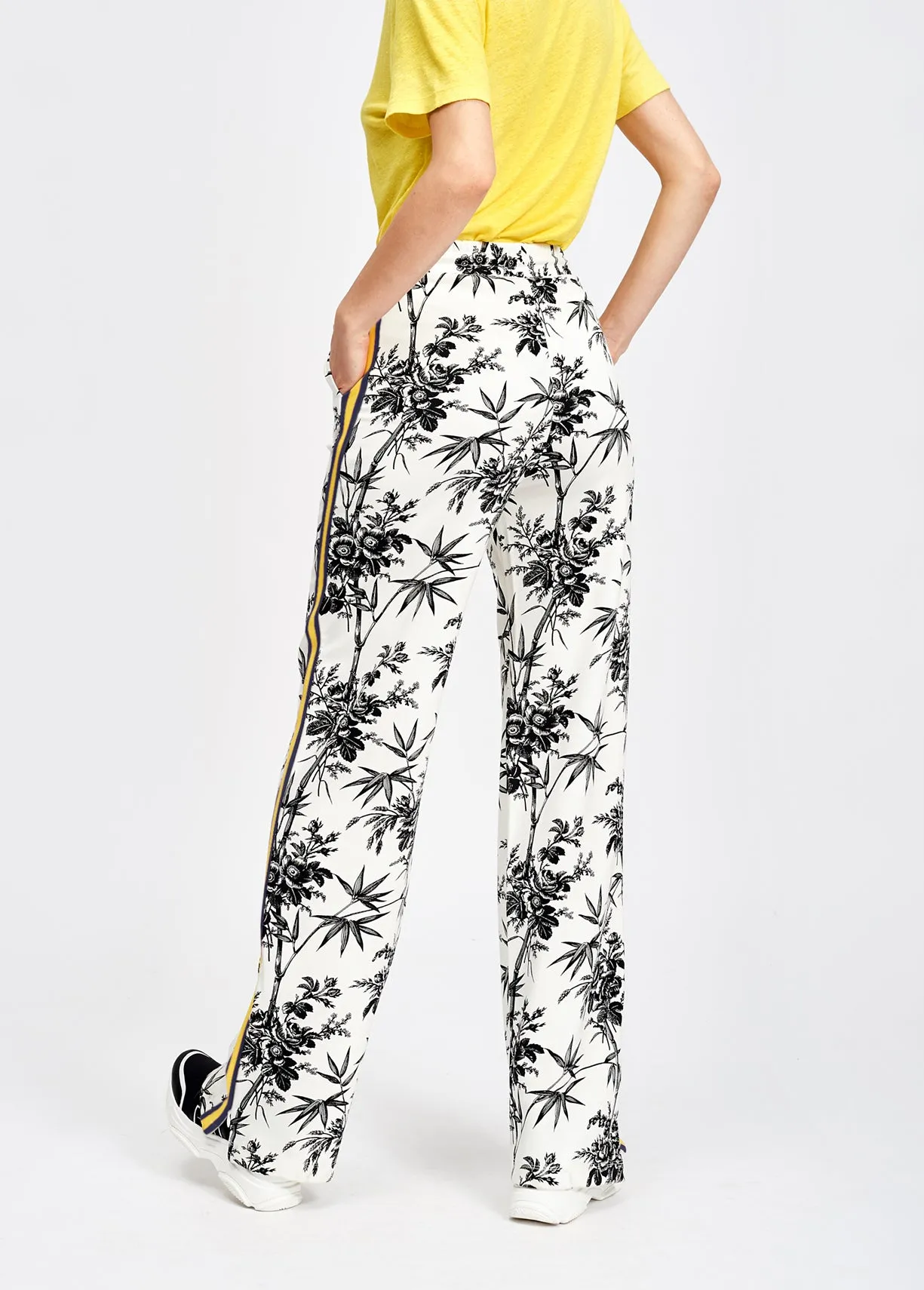 Classic white tracksuit pants with black print