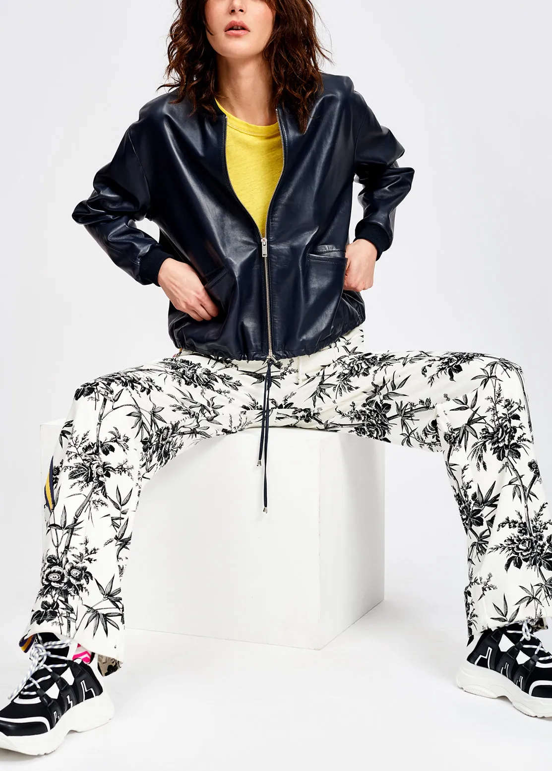 Classic white tracksuit pants with black print