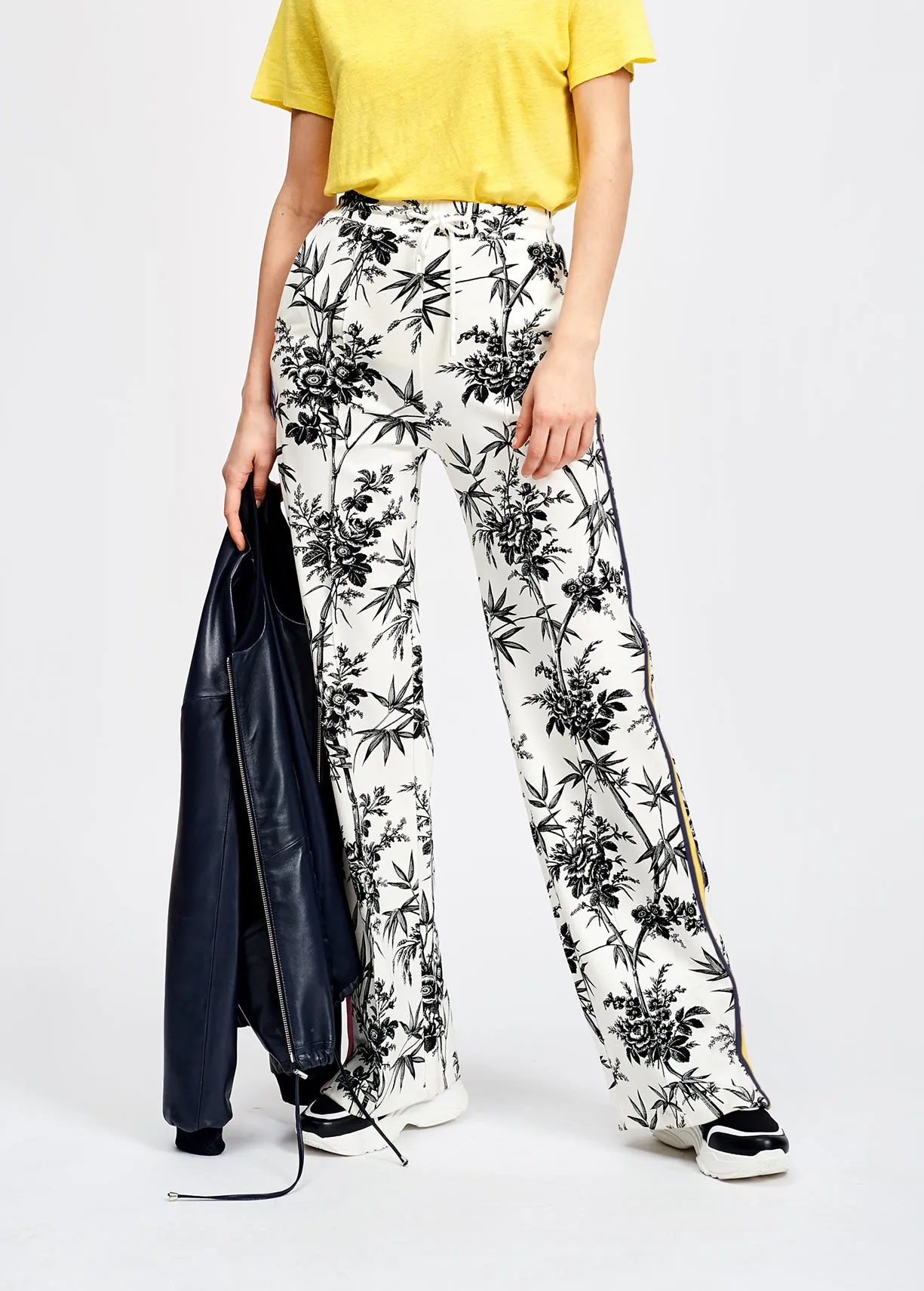 Classic white tracksuit pants with black print