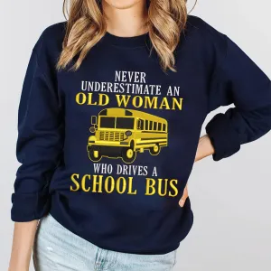 Never Underestimate An Old Woman Who Drives A School Bus Embroidered Sweatshirt - Embroidered Hoodie Tad